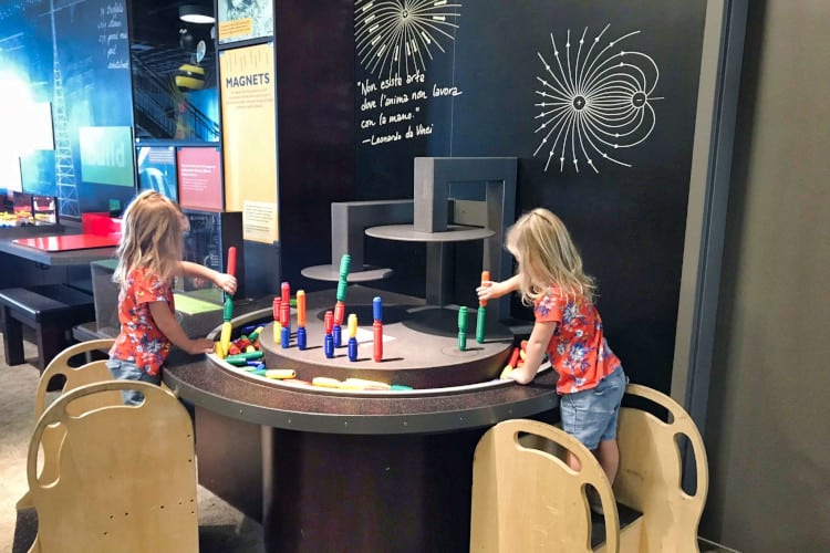 Toddlers playing at the Discovery Gateway, a great stop in Salt Lake with toddlers