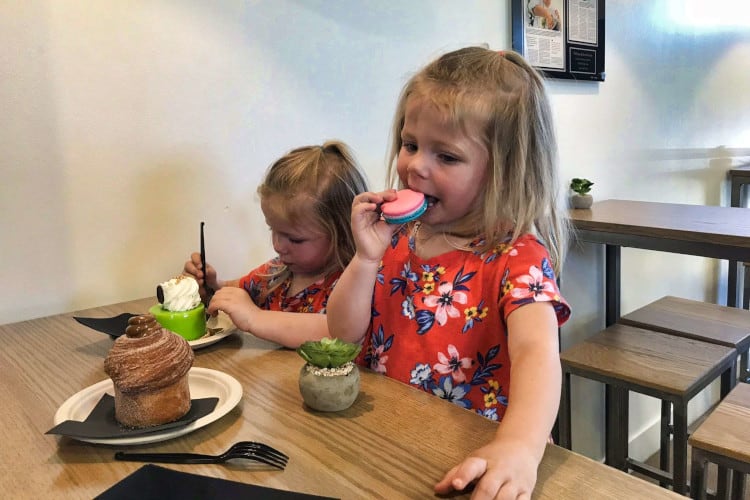 Toddlers enjoying macaroons from Filling & Emulsions, a great stop in Salt Lake with toddlers