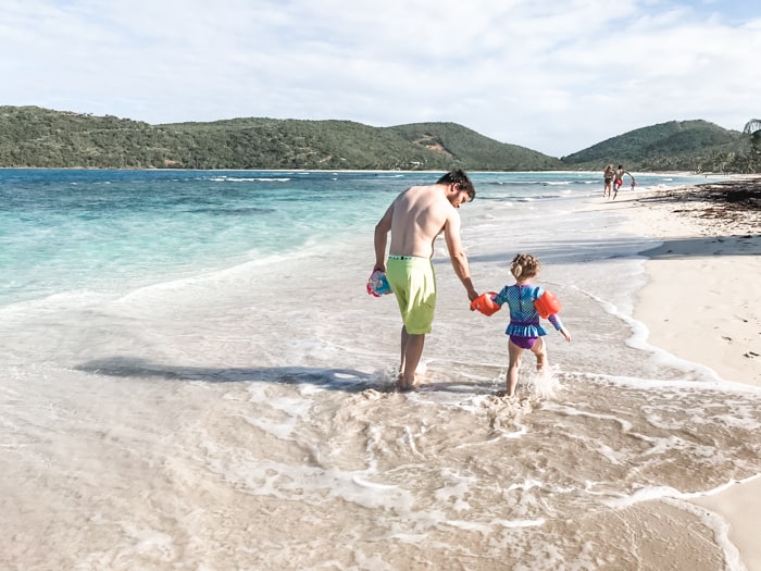 Father and daughter playing on the beach on Culebra Island Puerto Rico
