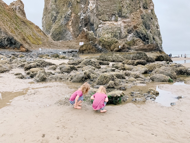 Girls tide pooling at Cannon Beach