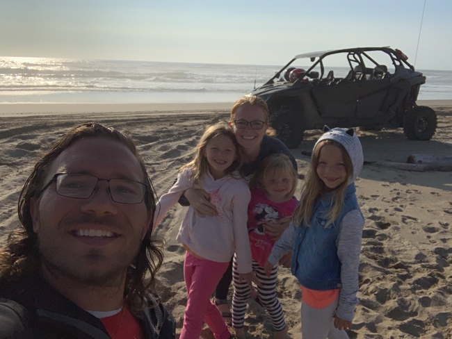 Family riding the Oregon Dunes with their OHV