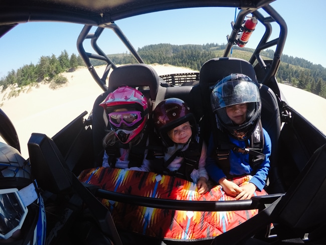 Kids riding in rzr at the Oregon Dunes National Recreation Area