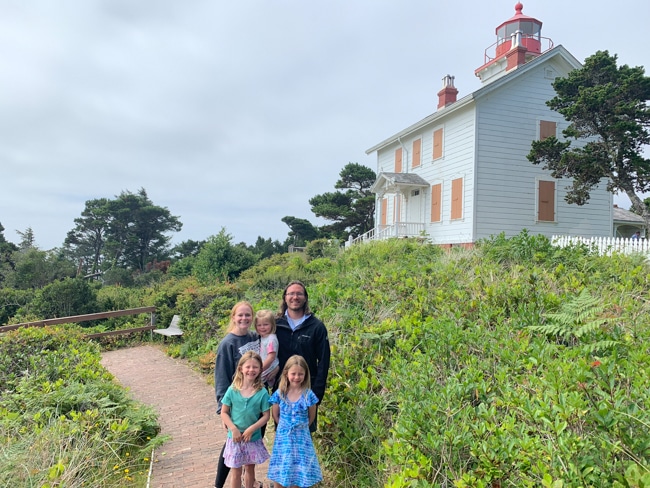 Family in front of a lighthouse