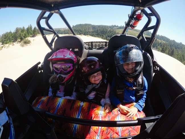 Kids riding in the rzr in the Oregon Dunes National Recreation Area