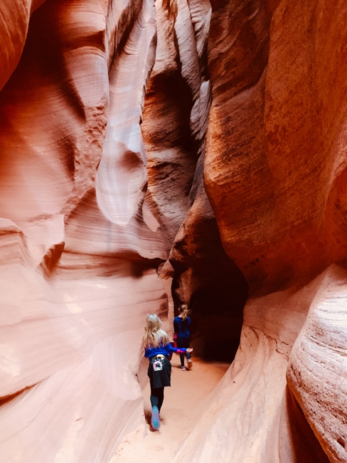 Girls walking through Antelope Canyon X
