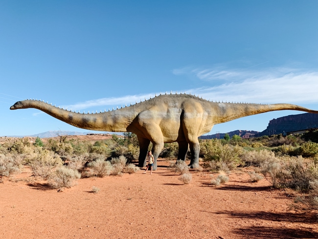 Standing with the dinosaurs at Moab Giants in Moab, Utah