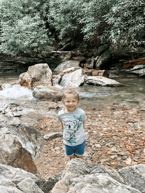 Girl in the stream near Skinny Dip Falls