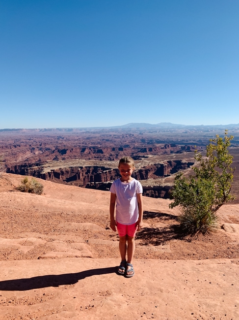 Girl hiking on the Grand View Point Trail in Moab