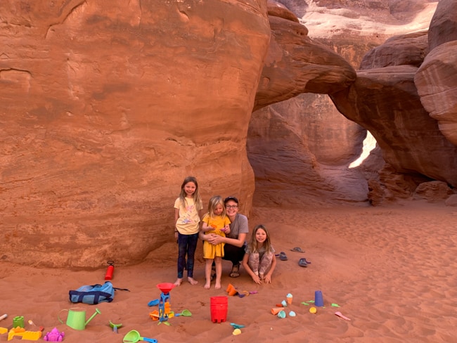 Playing with sand toys at Sand Dune Arch