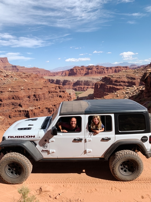 My husband and daughter driving a jeep in Canyonlands National Park