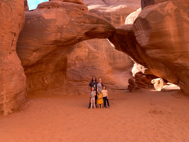 Family at Sand Dune Arch in one of the national parks in Utah