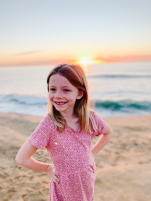 Girl at sunset cliffs in San Diego