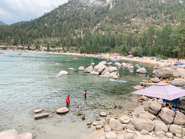 People swimming on the beach in Lake Tahoe