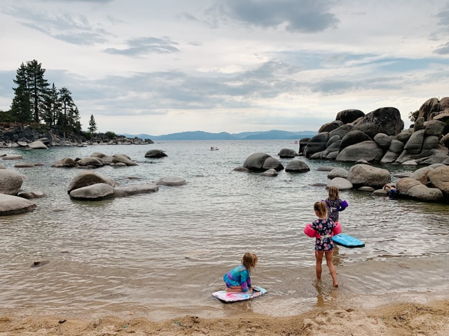 My girls playing on beach boards in Lake Tahoe