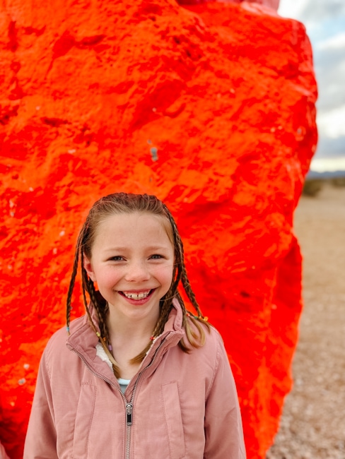 Girl standing in front of Seven Magic Mountains