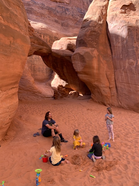 My family playing at Sand Dune Arch