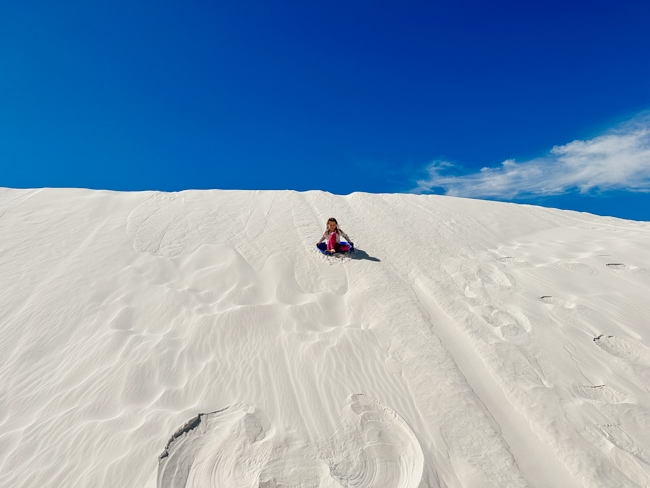 Sledding at White Sands in New Mexico