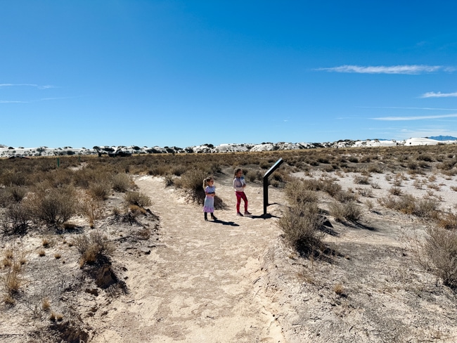 My kids reading the signs on the Playa Trail