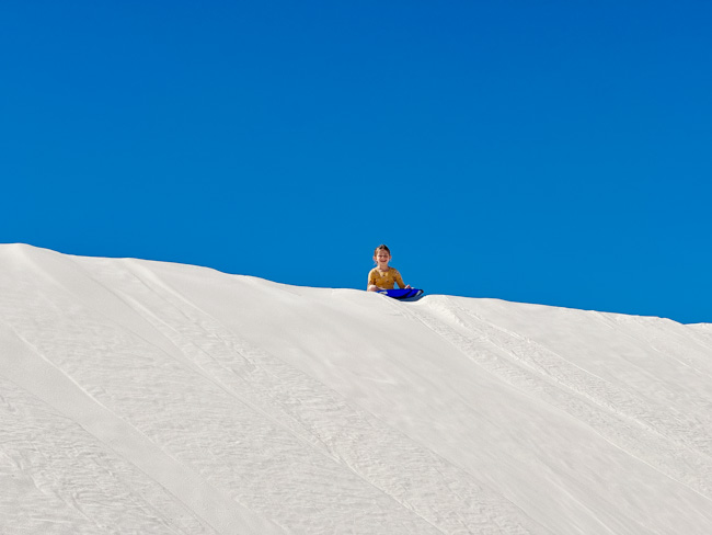 Sledding in White Sands National Park