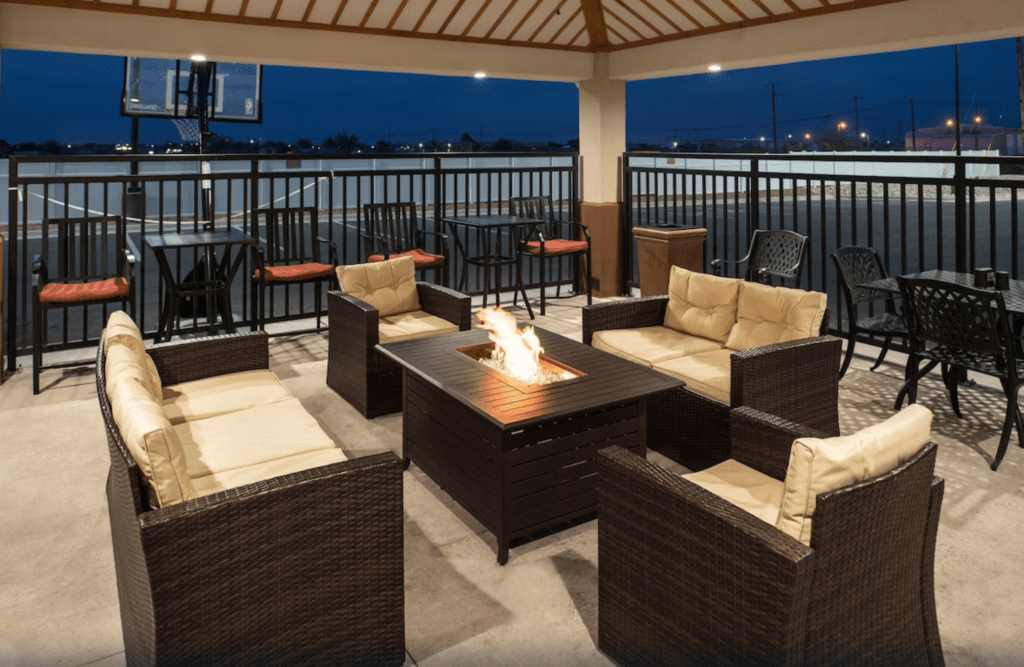 Patio area with fire pit at Candlewood Suites Carlsbad South.