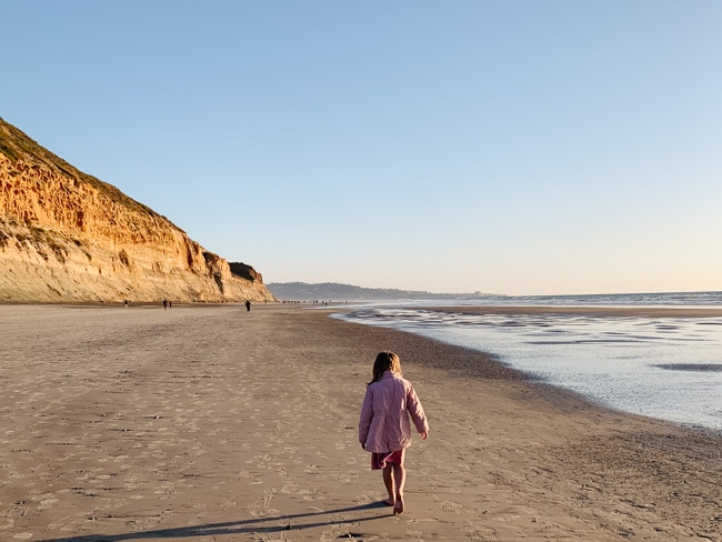 My daughter walking on the beach in San Diego, California