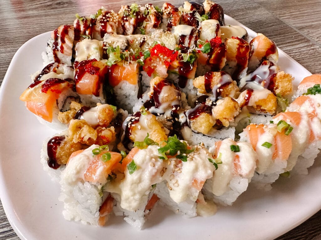 A plate of sushi rolls from Yoi Tomo Sushi and Grill.