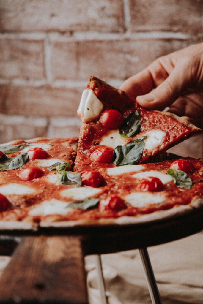 Pizza served on a platter, hot out of the oven