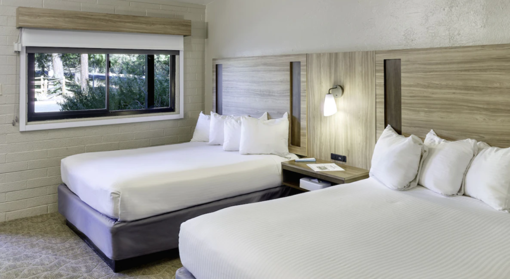 Two beds in a staying room at Yavapai Lodge, one of the best places to stay when traveling from Las Vegas to the Grand Canyon.