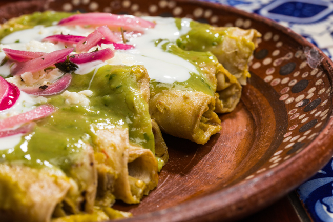 A Mexican dish smothered with verde sauce, sour cream and onions at Casa Mexico, one of the best Boise restaurants.