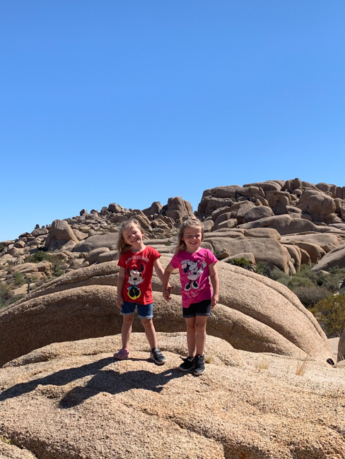 Children on the rocks in the desert in California