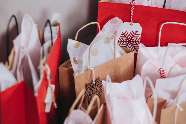 Several paper Christmas bags.