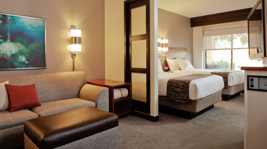 A staying room with both living and sleeping areas at The Hyatt Place Boise/Downtown.