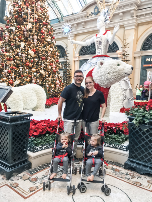 Family in front of holiday decorations in Las Vegas in December.
