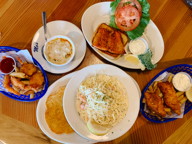 Several dishes of food on a table top at Mo's Restaurant.
