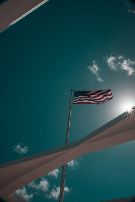 An American Flag flying over Pearl Harbor in Oahu in January.
