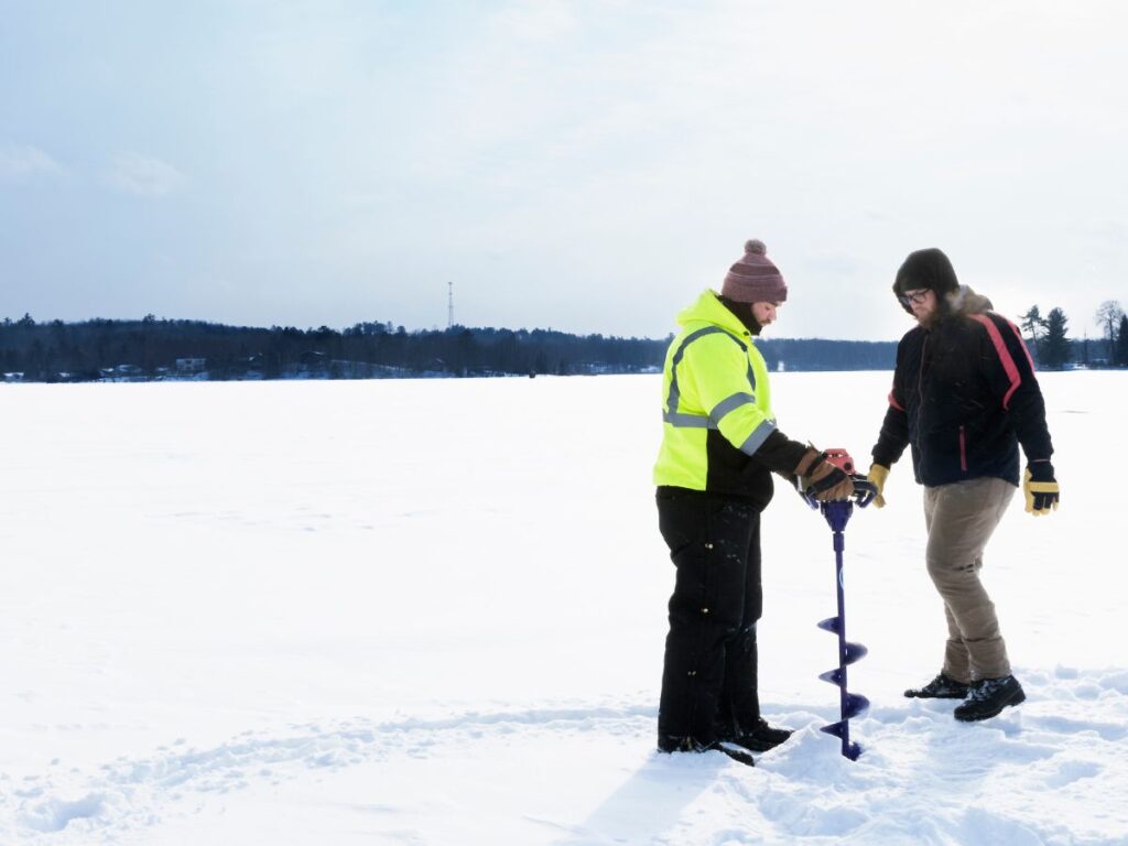 Ice fishing at a frozen lake