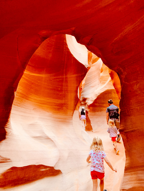 A family walking through the canyon during one of the antelope canyon tours from Las Vegas.