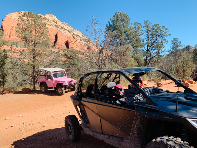 Our rzr and a pink jeep driving the 4x4 trail in Sedona
